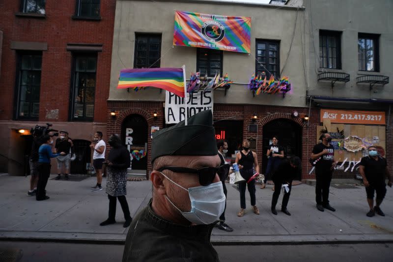 People gather at the Stonewall Inn for a rally in support of the Supreme Court decision to uphold LBGTQ+ workplace rights in New York