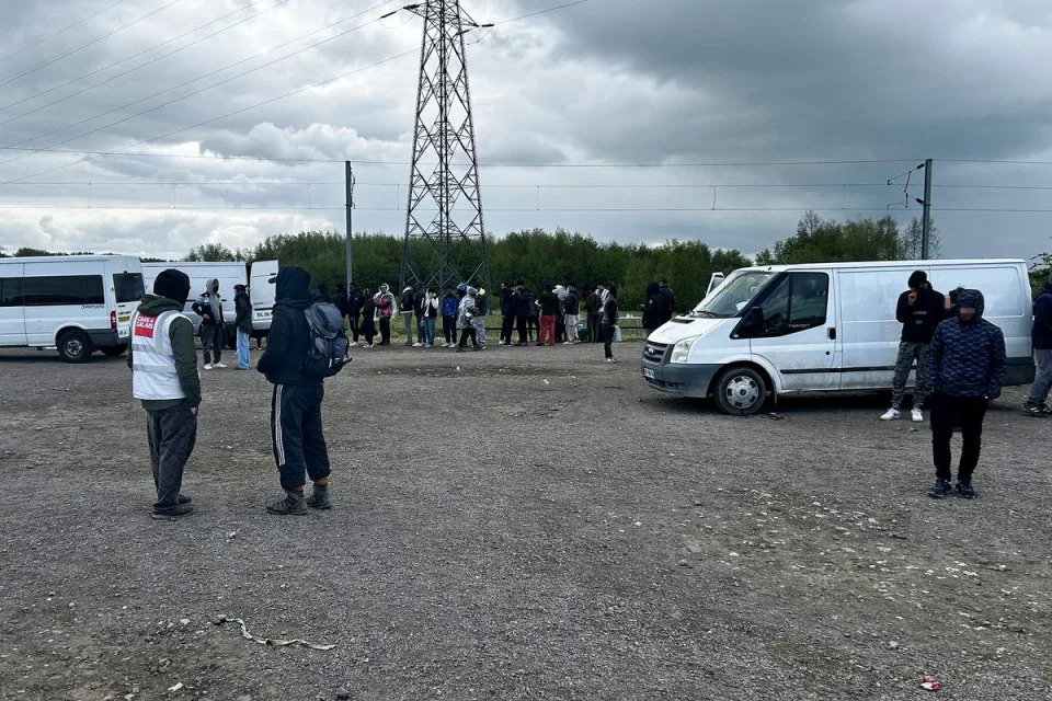 Charities give out blankets, groundsheets and tents to refugees who live in the woods round Dunkirk (The Independent)