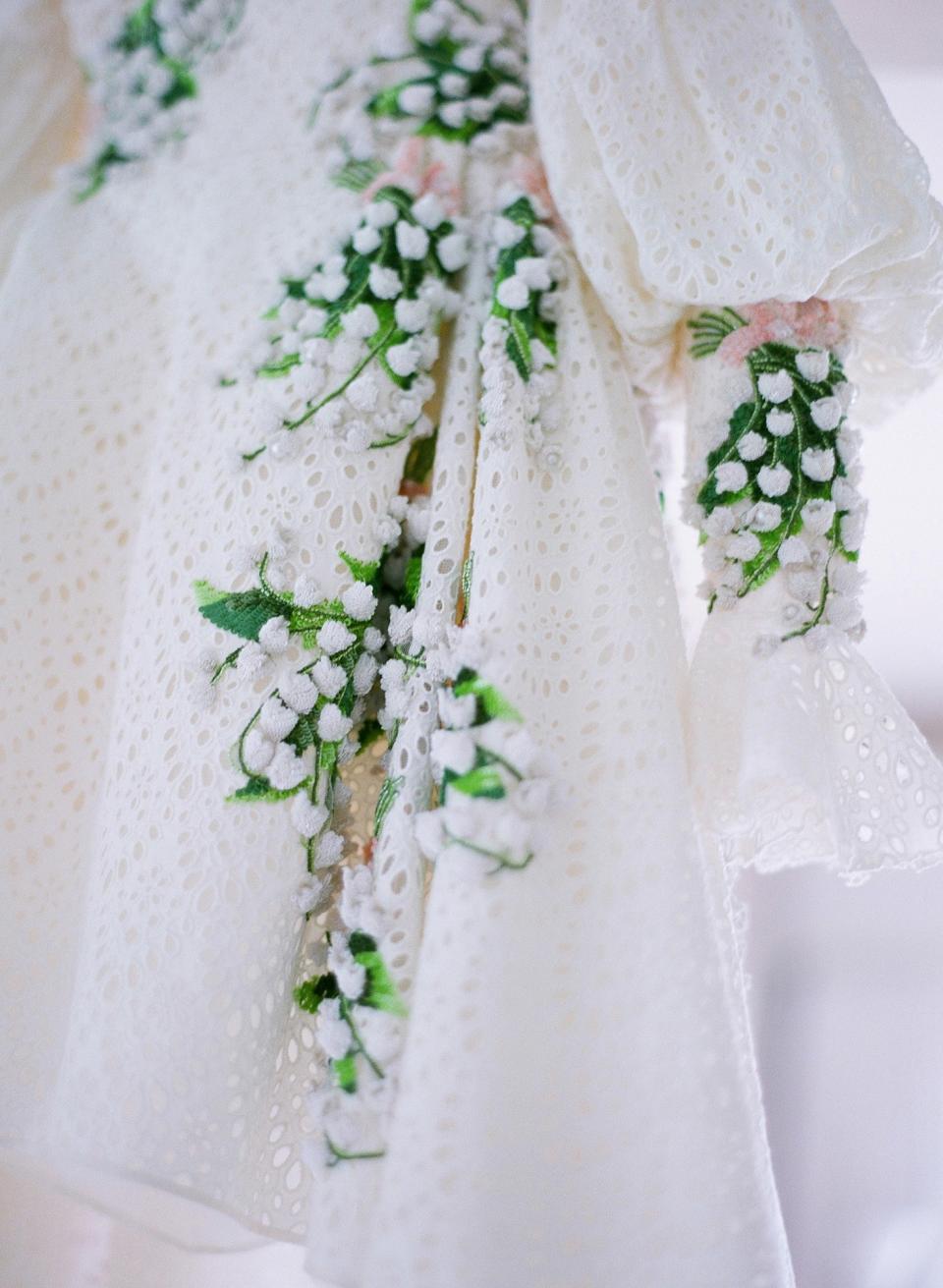 I have always loved the timeless elegance of Giambattista Valli’s designs. Wanting my dress to reflect the romance and ease of the evening, I was immediately drawn to the vintage eyelet lace and hand-embroidered lily of the valley. It was me in a dress!