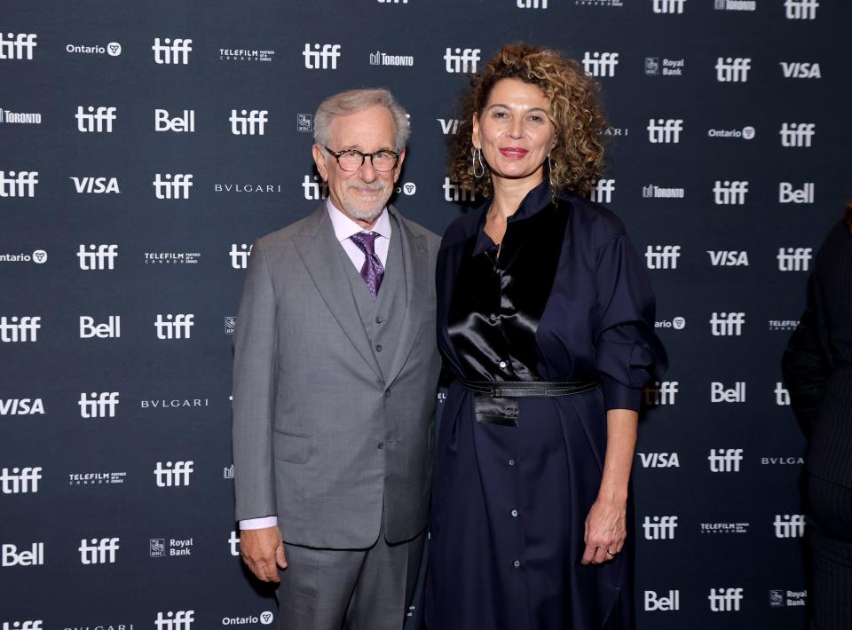 Steven Spielberg in a grey suit next to Donna Langley in a dark dress