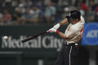 Texas Rangers' Evan Carter hits a single during the second inning of a baseball game against the Oakland Athletics in Arlington, Texas, Friday, Sept. 8, 2023. (AP Photo/LM Otero)