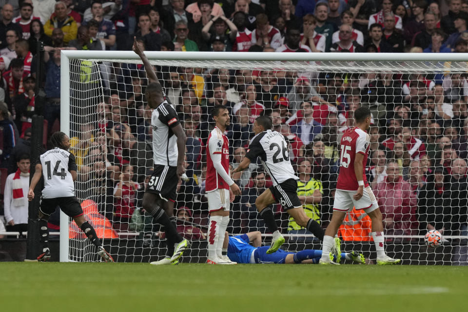 Fulham's Joao Palhinha, second right, scores his side's second goal during the English Premier League soccer match between Arsenal and Fulham at Emirates stadium in London, Saturday, Aug. 26, 2023. (AP Photo/Frank Augstein)