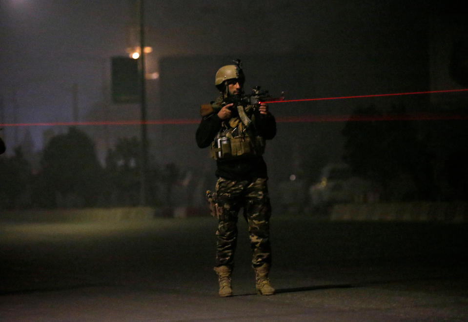 <p>An Afghan security force keeps watch near the site of an attack on the Intercontinental Hotel in Kabul, Afghanistan on January 20, 2018. (Photo: Mohammad Ismail/Reuters) </p>