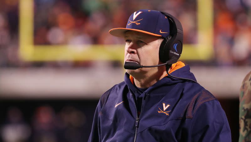 Virginia Cavaliers coach Bronco Mendenhall watches a play during a game with Notre Dame in Charlottesville, Va., on Thursday, Nov. 13, 2021.
