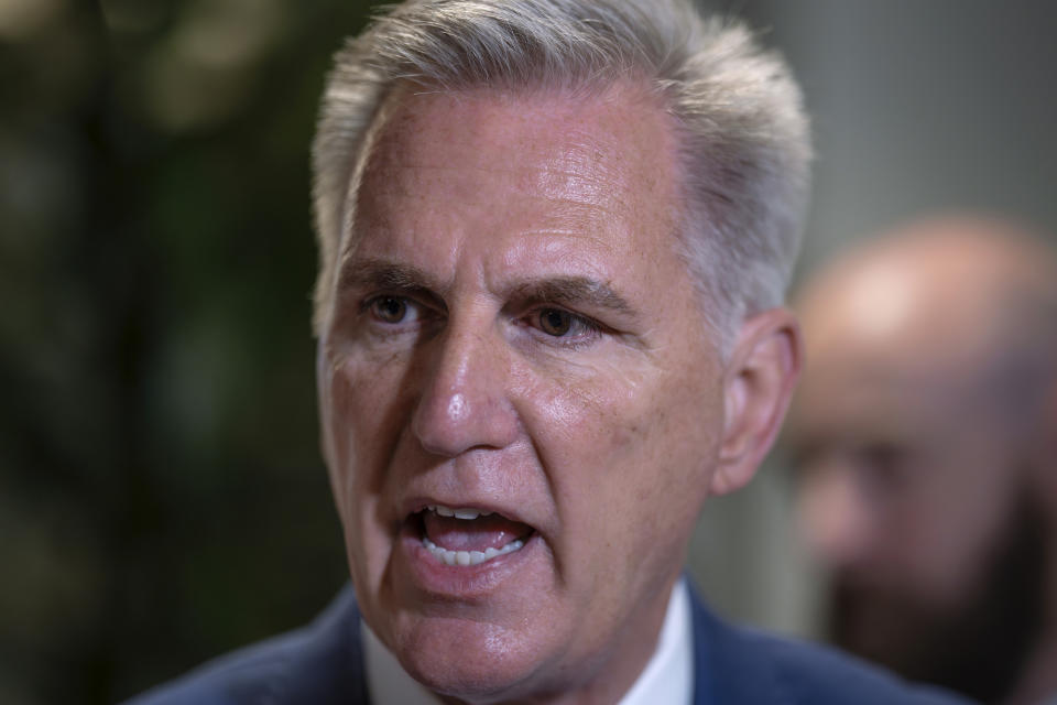 Speaker of the House Kevin McCarthy, R-Calif., talks to reporters about avoiding a government shutdown and launching an impeachment inquiry into President Joe Biden, following a closed-door meeting with fellow Republicans at the Capitol in Washington, Thursday, Sept. 14, 2023. (AP Photo/J. Scott Applewhite)