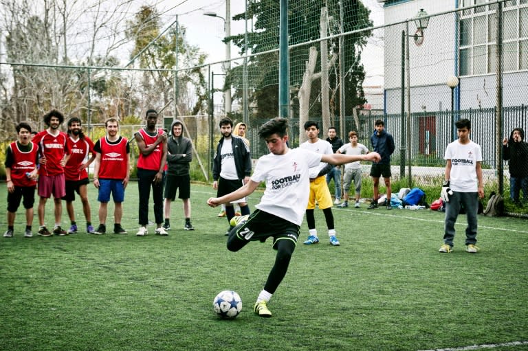 Going for goal: Jawad Ahmadi takes a penalty kick during a tournament with teams composed of refugees and European volunteers in Athens