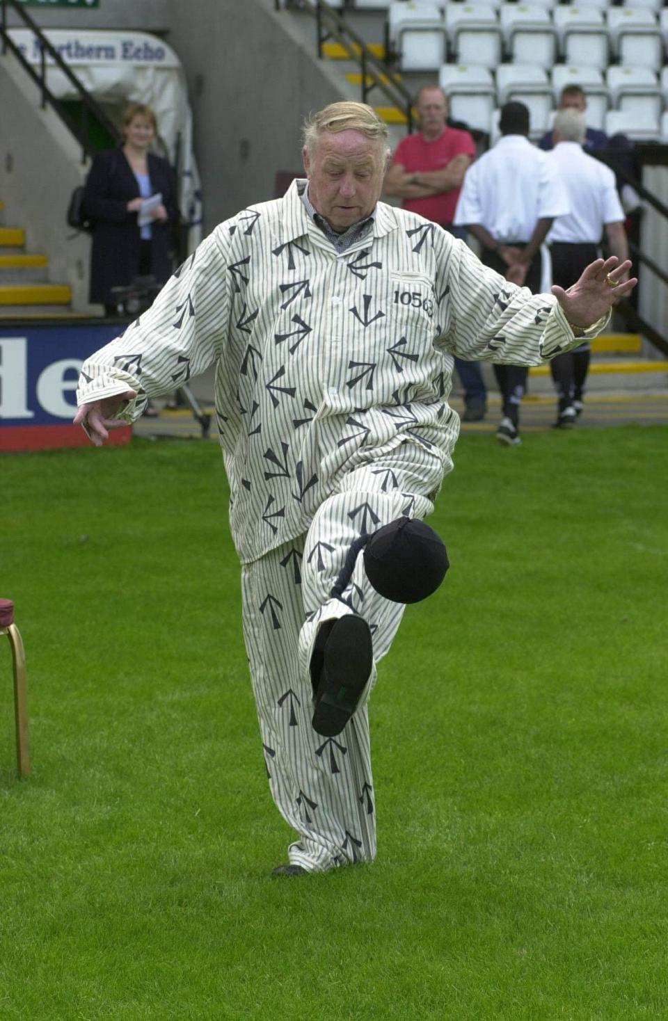 George Reynolds appears on the Darlington FC pitch in 2001 in a mock prison suit: he was proud of his hardscrabble background - Raoul Dixon / NNP