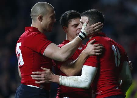 Jonny May (R) of England is congratulated by teammates after scoring a try against Samoa during their international rugby test match at Twickenham in London, November 22, 2014. REUTERS/Andrew Winning