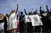 FILE - In this June 8, 2020, file photo, Melina Abdullah, left, of Black Lives Matter Los Angeles, leads a crowd in a raising of fists in Los Angeles during a protest over the death of George Floyd who died May 25 after he was restrained by Minneapolis police. The Black Lives Matter Global Network Foundation, which grew out of the creation of the Black Lives Matter movement, is formally expanding a $3 million financial relief fund that it quietly launched in February 2021, to help people struggling to make ends meet during the ongoing coronavirus pandemic. (AP Photo/Marcio Jose Sanchez, File)