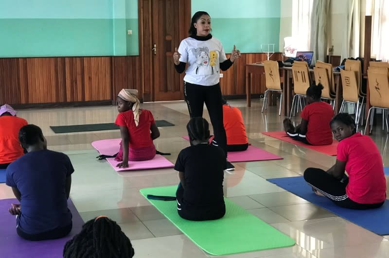 Congolese dance teacher Amina Lusambo talks to rape survivors at a rehabilitation centre attached to the Panzi Hospital before a dance session in Bukavu