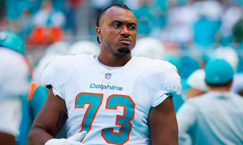Miami Dolphins guard Austin Jackson (73) looks from the sidelines during fourth quarter of an NFL football game against the New England Patriots at Hard Rock Stadium on Sunday, September 11, 2022 in Miami Gardens, Florida.
