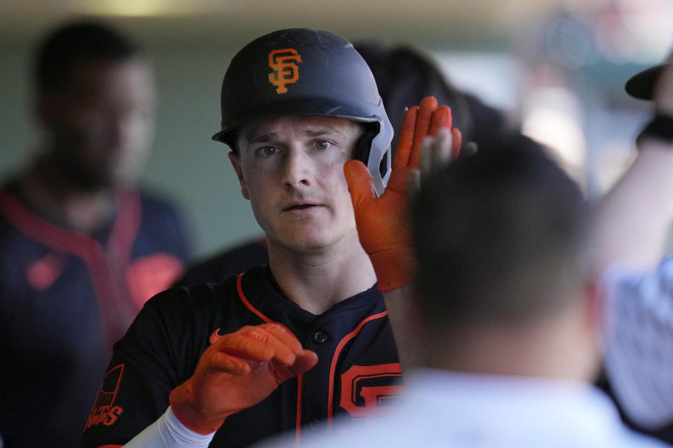 San Francisco Giants' Matt Chapman celebrates after scoring against the Chicago Cubs during the second inning of a spring training baseball game Friday, March 22, 2024, in Scottsdale, Ariz. (AP Photo/Ross D. Franklin)