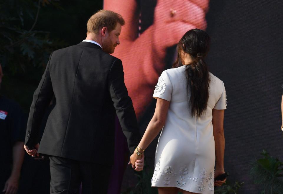 Prince Harry and Meghan Markle leave hand in hand after speaking during Global Citizen Live in Central Park on Sept. 25, 2021, in New York.