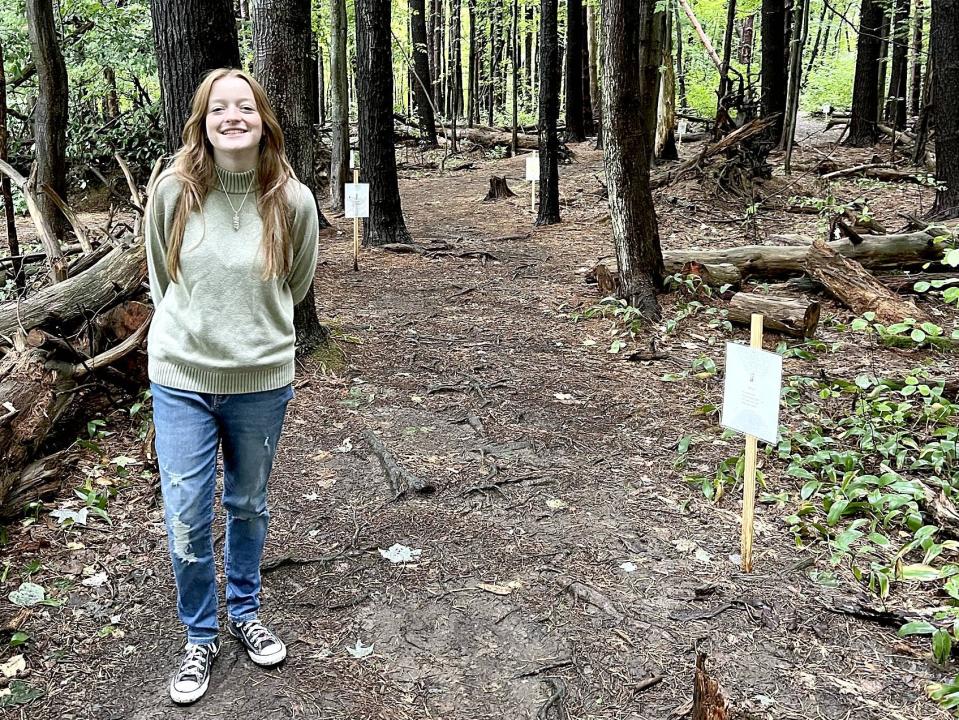 Kendall Laurin, 14, is shown next to her storybook trail at Asbury Woods, 4105 Asbury Road in Millcreek Township, on Sept. 26, 2022. Laurin chose to create a storybook trail for her Girl Scout Silver Award project.