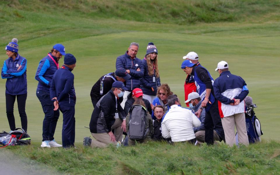 Tom Felton collapses on the 18th hole - REUTERS