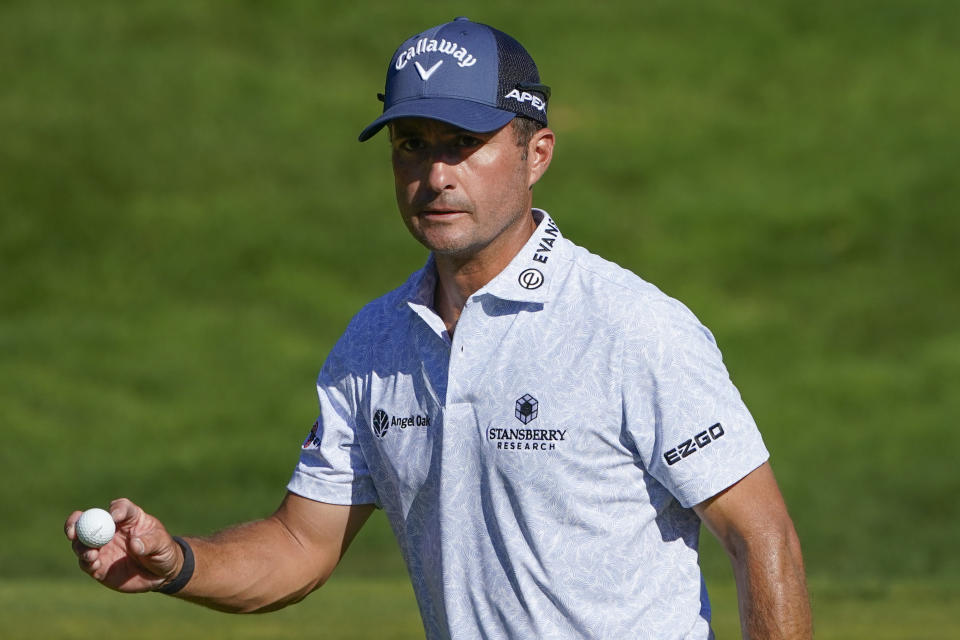 FILE - Kevin Kisner acknowledges the gallery after sinking a putt on the 18th hole during the third round of the Travelers Championship golf tournament at TPC River Highlands, Saturday, June 25, 2022, in Cromwell, Conn. Kisner will compete on the American team at the Presidents Cup beginning Thursday, Sept. 22. (AP Photo/Seth Wenig, File)