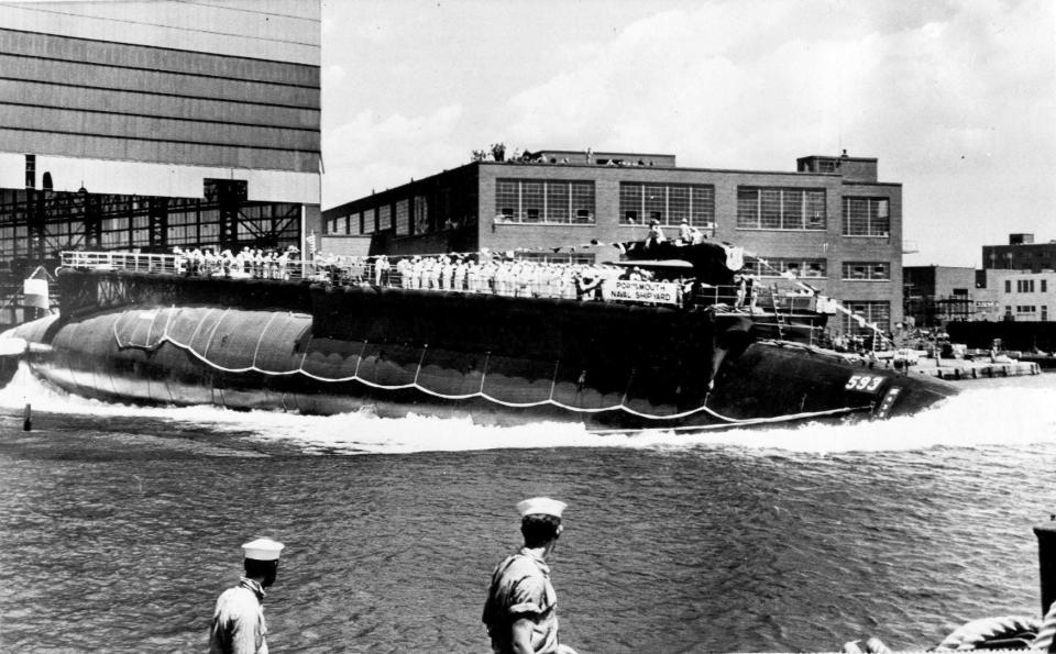 In this July 9, 1960, file photo the nuclear-powered attack submarine USS Thresher, a first in its class boat, is launched at Portsmouth Naval Shipyard.
