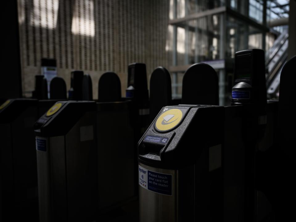 A row of contactless payment points for debit and "Oyster" cards are seen at the new Elizabeth Line section of Paddington station ahead of the planned opening date.