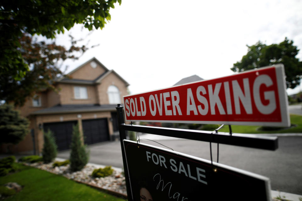 A real estate sign that reads 