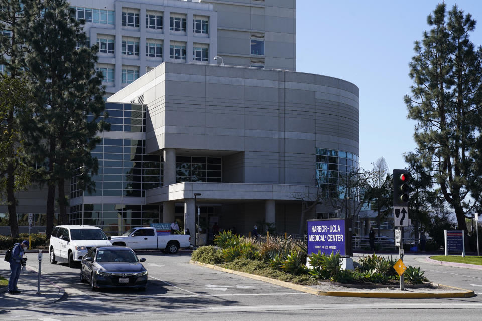 Vehicles leave Harbor-UCLA Medical Center Wednesday, Feb. 24, 2021, in Torrance, Calif. Golfer Tiger Woods was hospitalized and underwent surgery at the hospital following a car accident on Tuesday. (AP Photo/Ashley Landis)