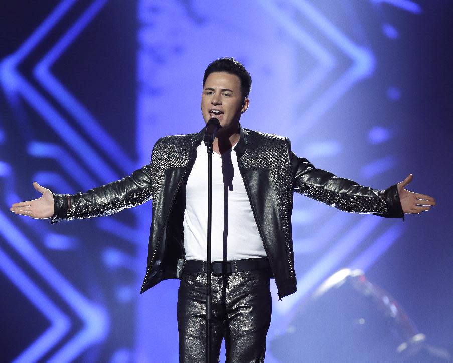 Ryan Dolan of Ireland performs his song "Only Your Love Survives" during a rehearsal for the final of the Eurovision Song Contest at the Malmo Arena in Malmo, Sweden, Friday, May 17, 2013. The contest is run by European television broadcasters with the event being held in Sweden as they won the competition in 2012, the final will be held in Malmo on May 18. (AP Photo/Alastair Grant)