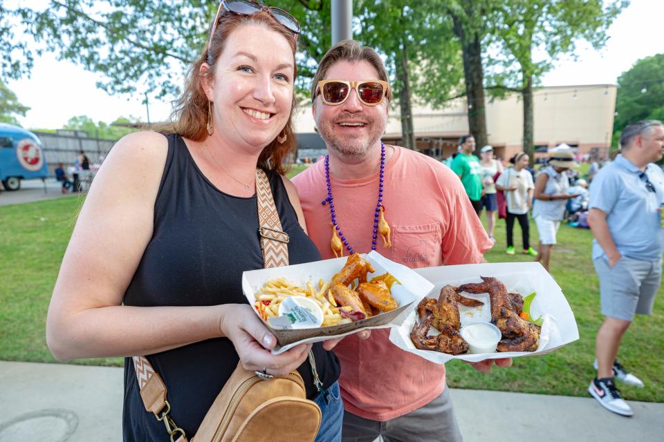 Attendees at GPAC Fried Chicken Fest at The Grove on Saturday, May 13, 2023 enjoy food from Mike's Hot Wings.