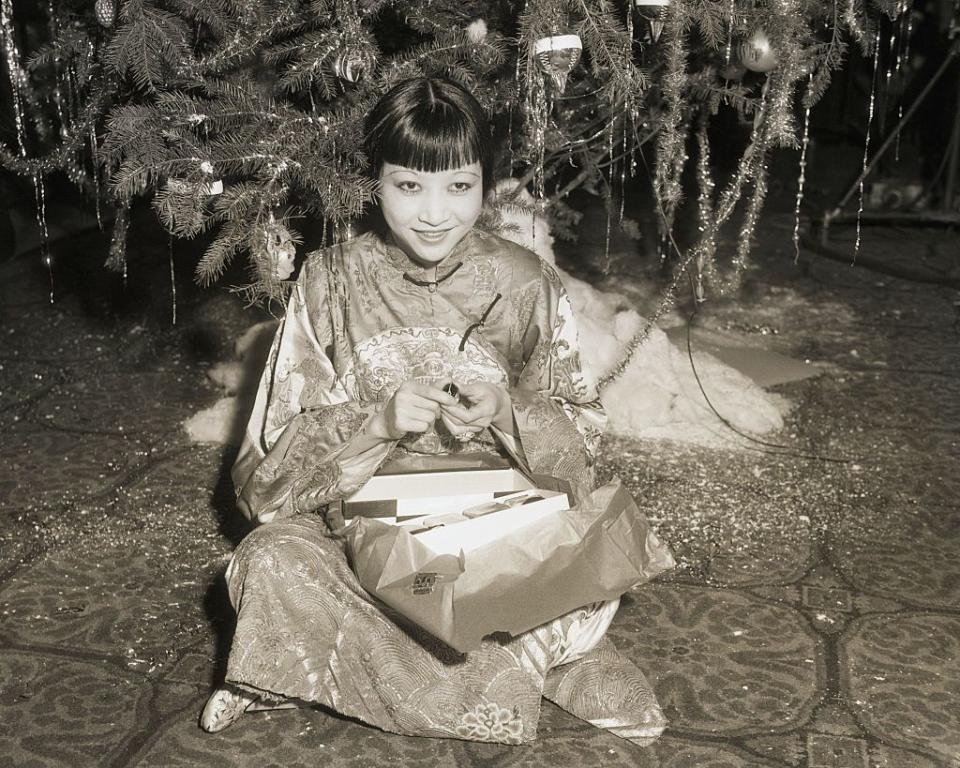 <p>Anna May Wong wears a traditional Chinese gown at a Hollywood Christmas party at the the Christy Hotel in 1932. </p>