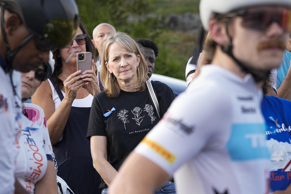 Kim Milligan, center, listens as a group of cyclists gather to remember her daughter, Alyssa Milligan, before a memorial ride in her honor Tuesday, Sept. 12, 2023, in Mount Juliet, Tenn. Milligan's daughter was struck and killed by a pickup truck while cycling with a friend the previous week. (AP Photo/George Walker IV)