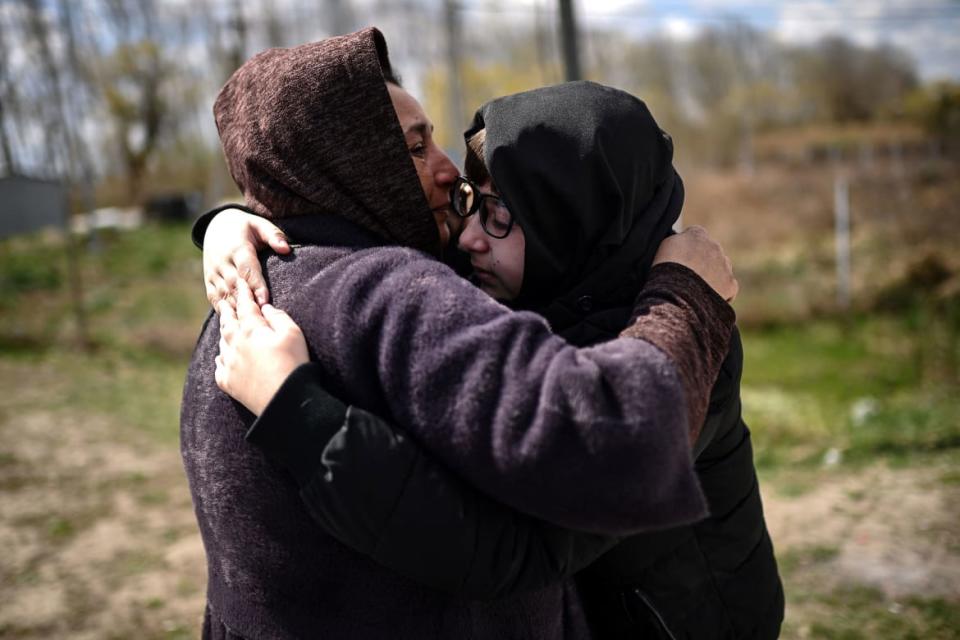 <div class="inline-image__caption"><p>Ukrainian refugees embrace after reuniting on their way back to Ukraine along the Ukrainian-Moldovan border on April 12.</p></div> <div class="inline-image__credit">Christophe Archambault/AFP via Getty</div>