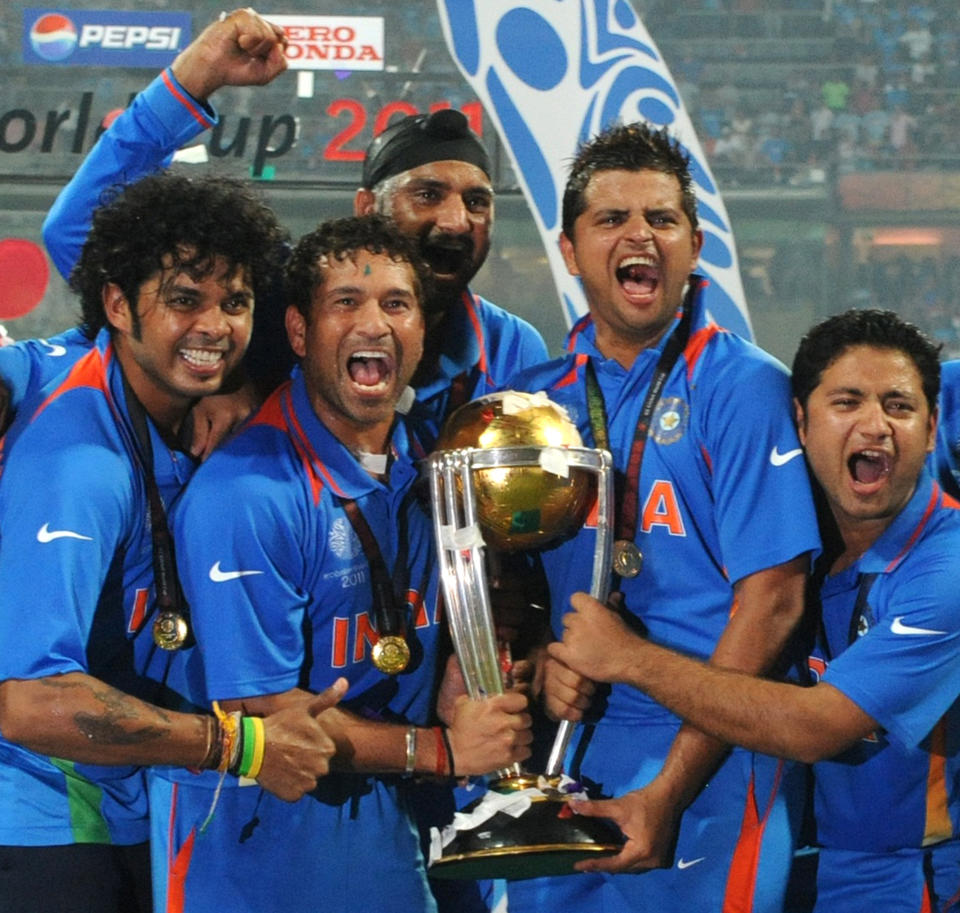 (L-R): Shanthakumaran Sreesanth, Sachin Tendulkar, Harbhajan Singh, Suresh Raina and Piyush Chawla pose with the trophy after victory in the Cricket World Cup 2011 final over Sri Lanka.