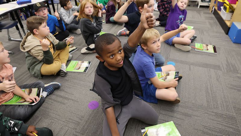 Wasatch Elementary School third grader Mounir Johnson gives a thumbs-up in class in Salt Lake City on Tuesday, Oct. 10, 2023. The school was designated a Blue Ribbon School by the U.S. Department of Education.
