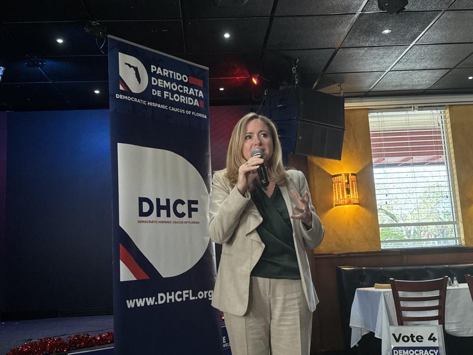 Former U.S. Rep. Debbie Mucarsel-Powell speaks to about 30 Hispanic leaders and voters at El Sabor Latino in Greenacres. A poll has her trailing U.S. Sen. Rick Scott by a broad margin.