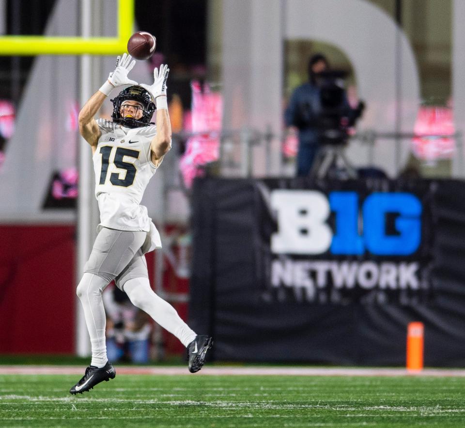 Purdue's Charlie Jones (15) catches a pass and scores during the second half of the Indiana versus Purdue football game at Memorial Stadium on Saturday, Nov. 26, 2022.