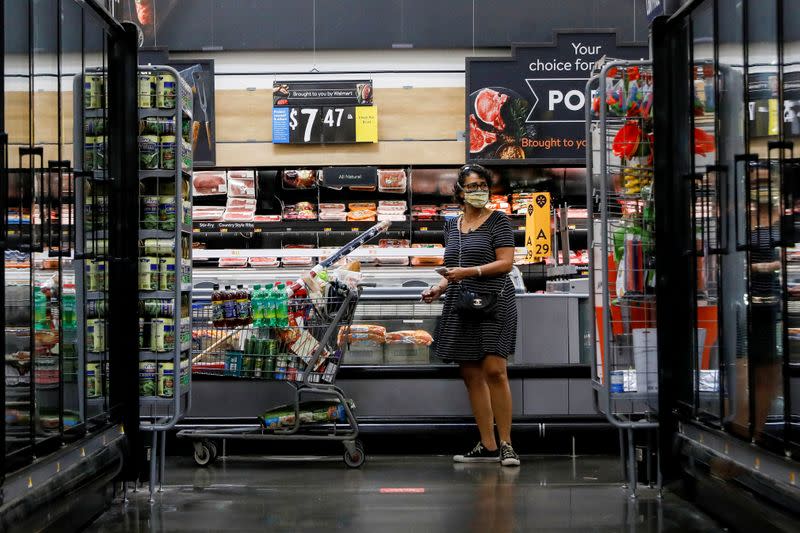 FILE PHOTO: A shopper is seen wearing a mask while shopping at a Walmart store in Bradford, Pennsylvania