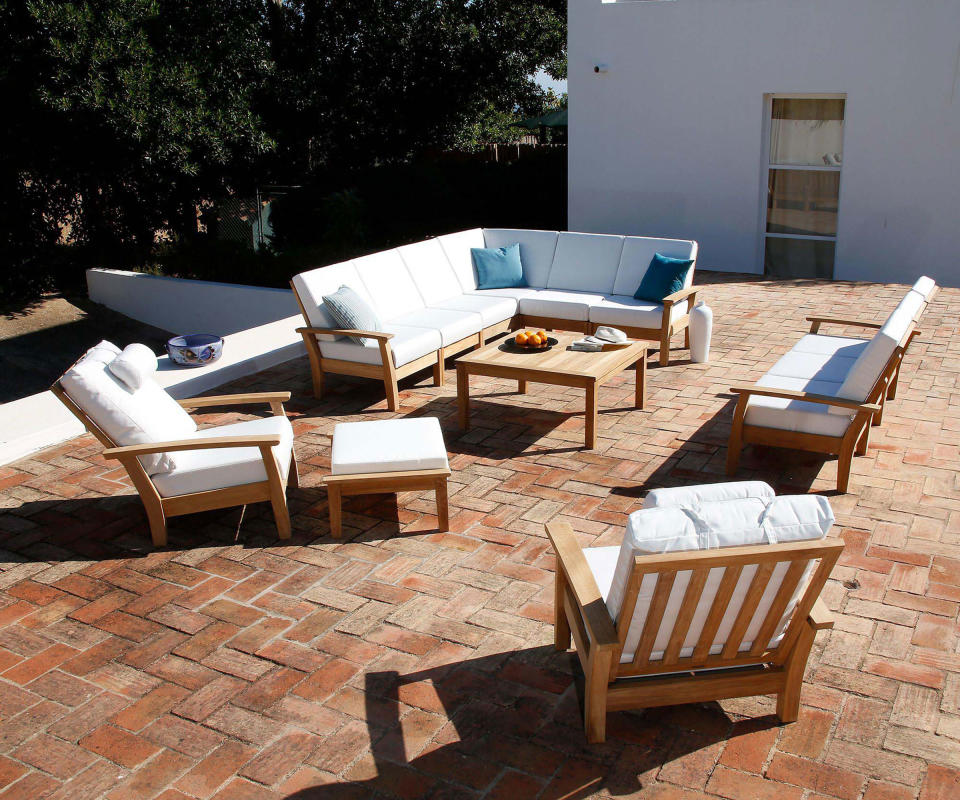 teak outdoor furniture set on a patio