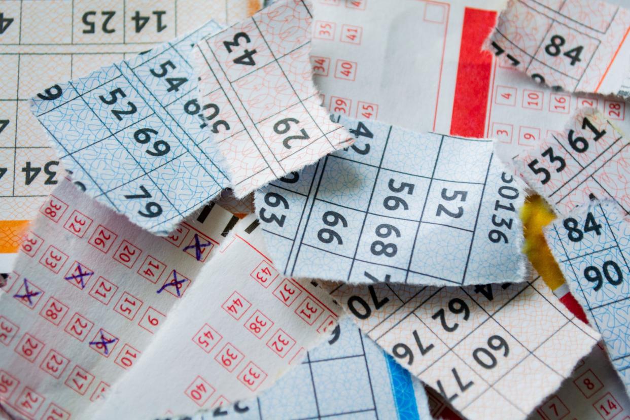 A stock image shows torn-up lottery tickets.
