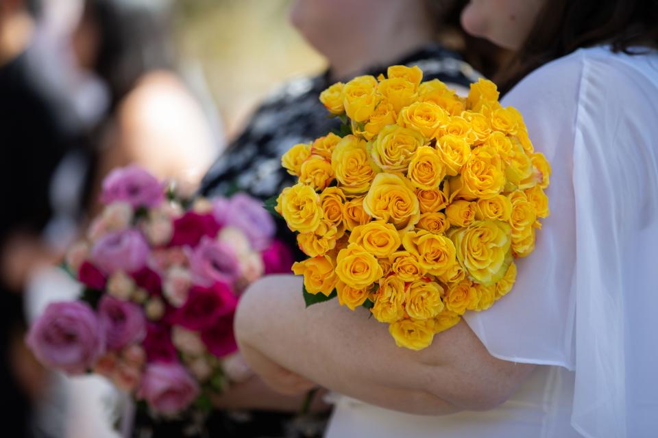 Clerk of Courts Gwen Marshall helps more than a dozen couples tie the knot with her second annual group wedding at Goodwood Museum and Gardens on Valentine's Day.