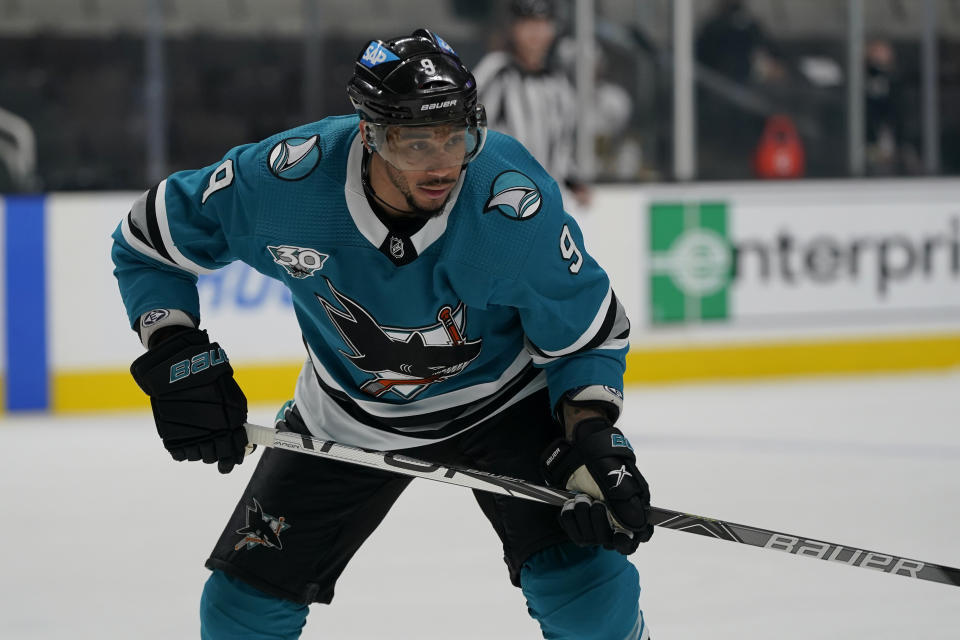 FILE - San Jose Sharks left wing Evander Kane looks on during an NHL hockey game against the Vegas Golden Knights in San Jose, Calif., May 12, 2021. The NHL has cleared Kane after an investigation into his cross-border travel during the holiday break, paving the way for him to join the Edmonton Oilers. A person with knowledge of the deal said Thursday, Jan. 27, 2022, Kane has agreed to terms with the Oilers on a contract for the remainder of the season. The person spoke to The Associated Press on condition of anonymity because the contract had not been announced. (AP Photo/Jeff Chiu, File)