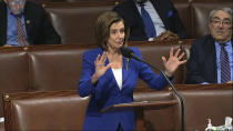 In this image from video, House Speaker Nancy Pelosi of Calif., speaks on the floor of the House of Representatives at the U.S. Capitol in Washington, Friday, March 27, 2020. (House Television via AP)