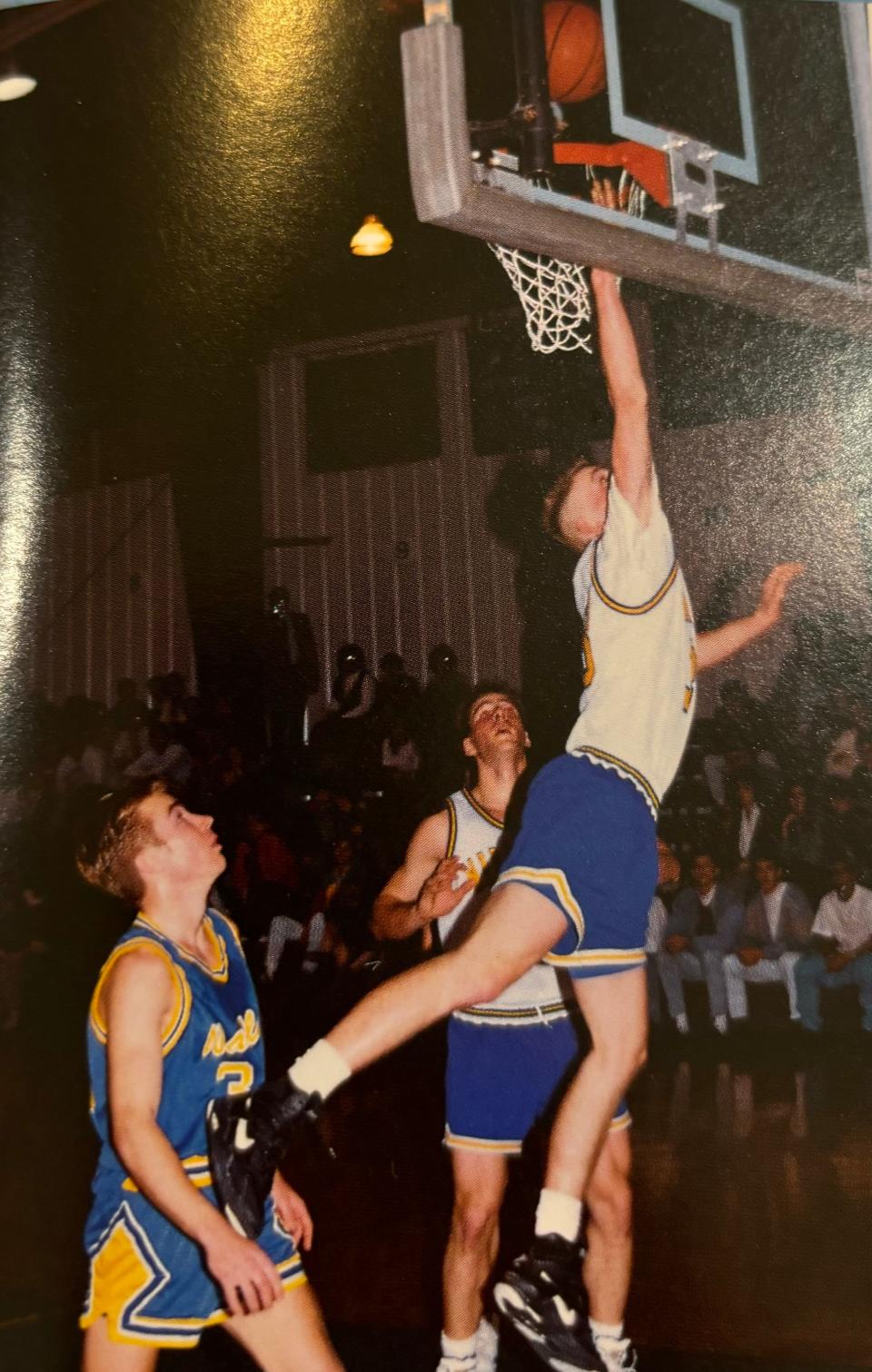Nate Oats (right) jumps to put in a layup his senior year of high school in 1992. He played for Maranatha Baptist Academy in Watertown, Wisconsin.