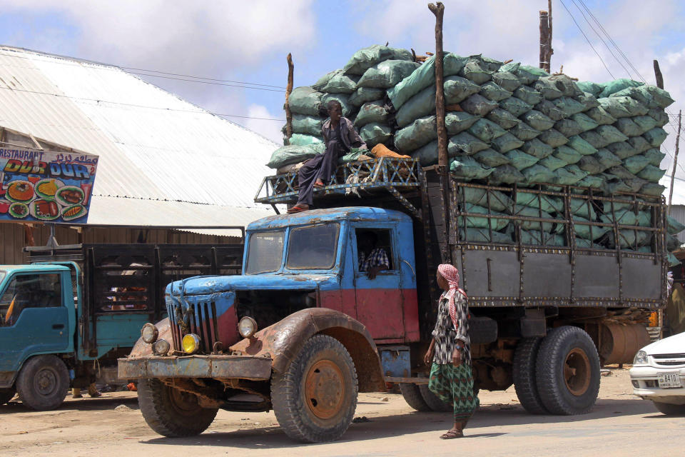 In this photo of Tuesday Oct. 30, 2012 a Somali charcoal truck loaded with sacks of charcoal arrive in Mogadishu. Thousands of sacks of dark charcoal sit atop one another in Somalia's southern port city of Kismayo, an industry once worth some $25 million dollar a year to the al-Qaida-linked insurgents who controlled the region. The good news sitting in the idle pile of sacks is that al-Shabab militants can no longer fund their insurgency through the illegal export of the charcoal. Kenyan troops late last month invaded Kismayo and forced out the insurgents, putting a halt to the export of charcoal, a trade the U.N. banned earlier this year in an effort to cut militant profits. The loss of the charcoal trade "will cut a major source of revenue and thus will have a detrimental effect on their operational capacity to carry out large scale attacks," Mohamed Sheikh Abdi, a Somali political analyst, said of al-Shabab. But the flip side to the charcoal problem is that residents who made their living from the trade no longer are making money, a potentially tricky issue for the Kenyan troops who now control the region. (AP Photo/Farah Abdi Warsameh)