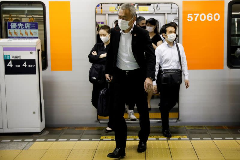 FILE PHOTO: Passengers pictured at Shibuya subway station in Tokyo