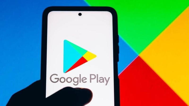 The Google Play app store logo on a phone. 