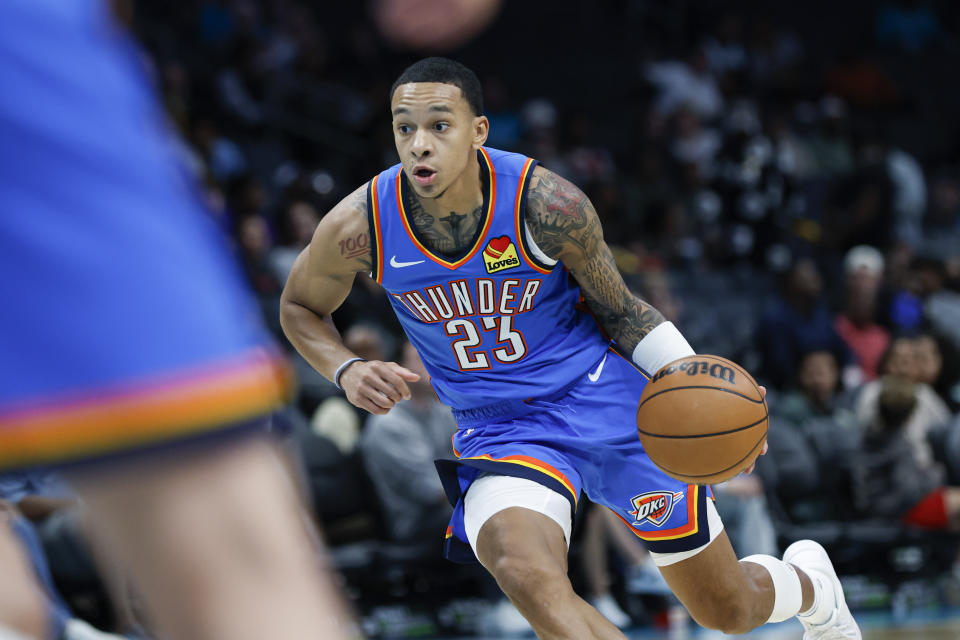 Oct 15, 2023; Charlotte, North Carolina, USA; Oklahoma City Thunder guard Tre Mann (23) pushes the ball up court against the Charlotte Hornets in the first half at Spectrum Center. Mandatory Credit: Nell Redmond-USA TODAY Sports