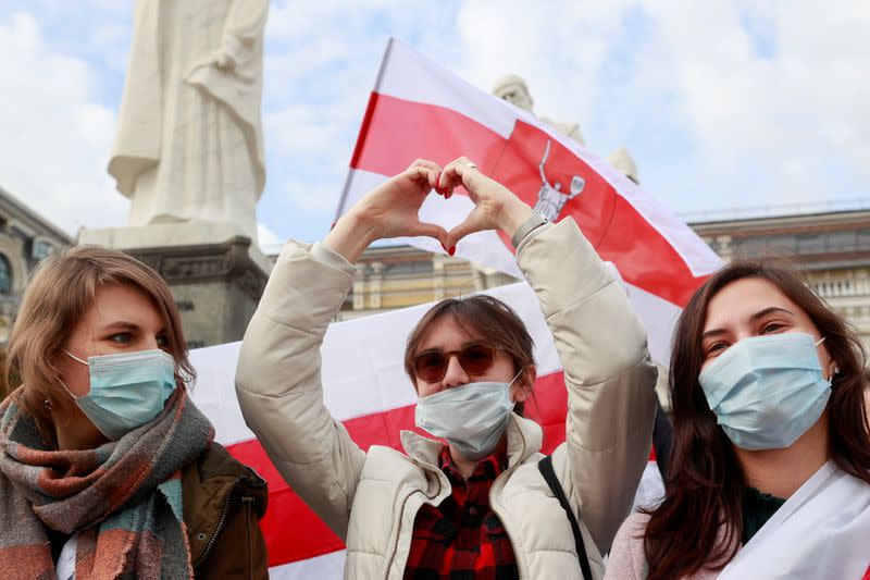 Demonstrators attend a rally in solidarity with Belarusian opposition in Kyiv