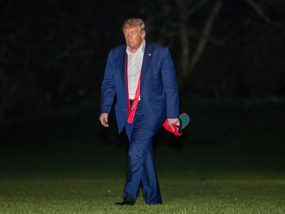 President Donald Trump walks on the South Lawn of the White House in Washington as he returns from a campaign rally in Tulsa, Oklahoma on June 21, 2020.