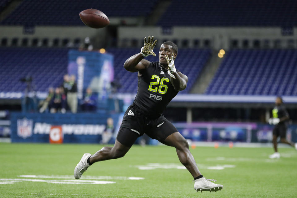Arizona running back J J Taylor runs a drill at the NFL football scouting combine in Indianapolis, Friday, Feb. 28, 2020. (AP Photo/Michael Conroy)
