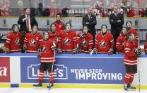 Canada's players and coaches watch a replay of a goal review against Finland during the third period of their IIHF World Junior Championship ice hockey game in Malmo, Sweden, January 4, 2014. The goal was counted. REUTERS/Alexander Demianchuk (SWEDEN - Tags: SPORT ICE HOCKEY)