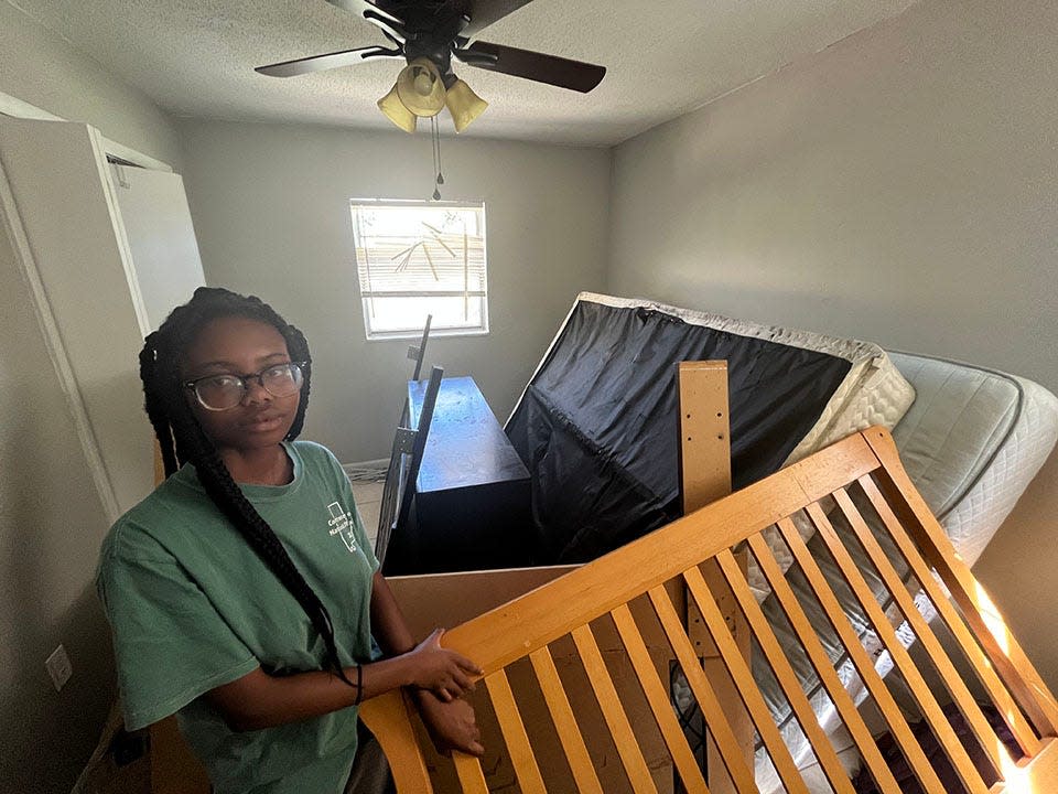 Lindsay Garconvil, 15, shows damage in her bedroom in the Dunbar neighborhood of Fort Myers on Sept. 30, 2022.