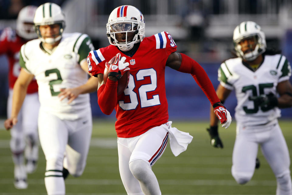 FILE - New England Patriots cornerback Devin McCourty (32) returns a kickoff for a touchdown in front of New York Jets kicker Nick Folk (2) and defensive back Isaiah Trufant (35) in the first quarter of an NFL football game in Foxborough, Mass., Sunday, Oct. 21, 2012. McCourty is retiring from the NFL, ending a 13-year run with the team that included winning three Super Bowl rings. (AP Photo/Stephan Savoia, File)